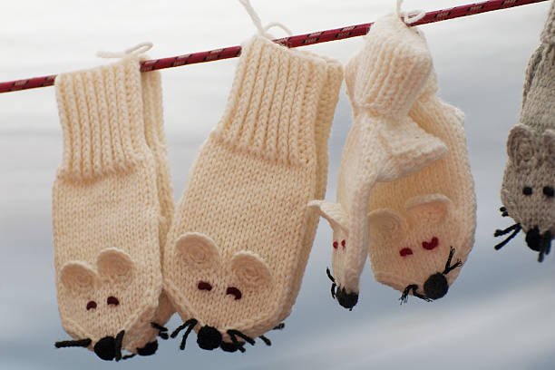 istock Wool baby mittens hanging on clothesline 181931574