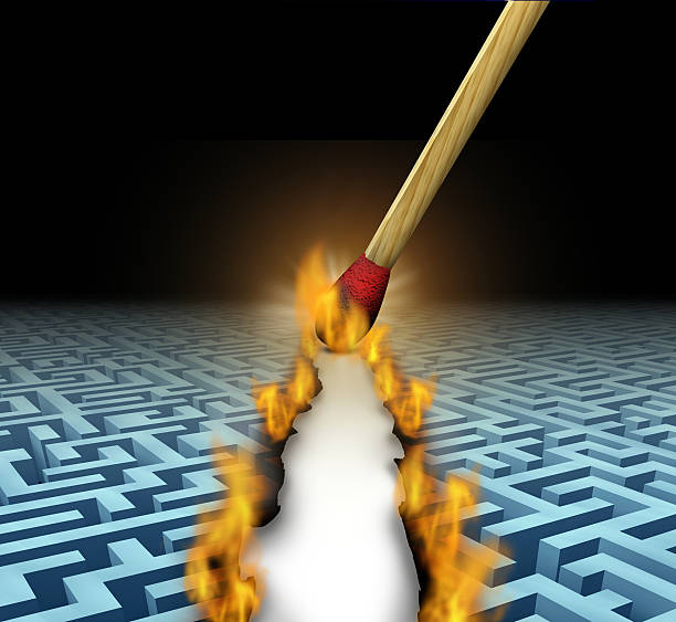 Creating New Opportunities Creating new opportunities with innovative solutions and trail blazing or trailblazing business concept with a lit wooden match opening a clear road through a maze or labyrinth by burning path as a symbol of creative thinking. trailblazing stock pictures, royalty-free photos & images