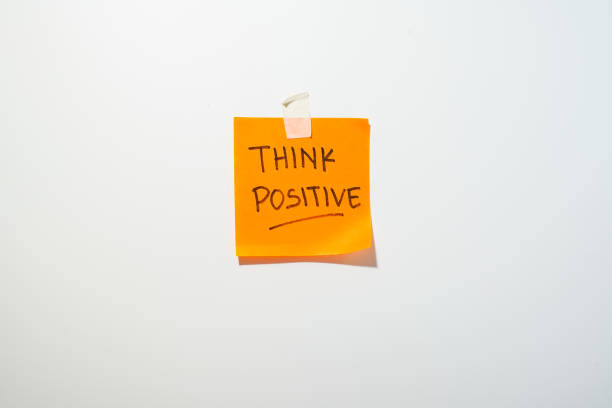 Motivational words for personal development, think positive, inspirational handwriting on sticky notes