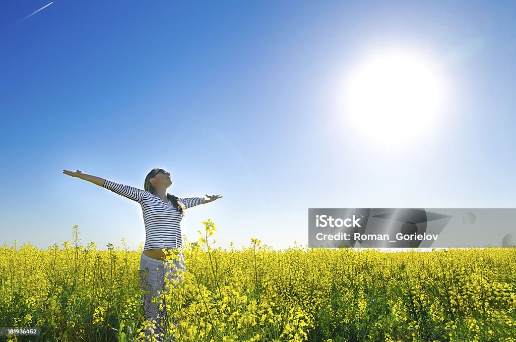 woman in the field woman standing in the field Adult Stock Photo