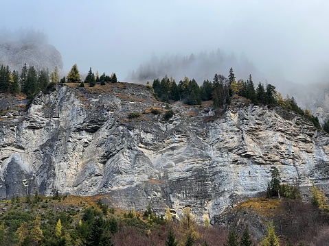 Steep stone cliffs and vertical rocks above the alpine river Tamina and over the Taminatal valley, Vättis - Canton of St. Gallen, Switzerland (Kanton St. Gallen, Schweiz)