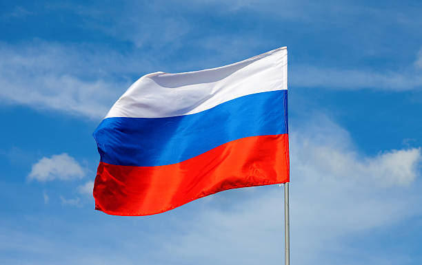 istock Russian flag waving in the wind over blue sky 181937592