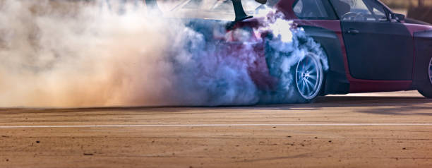 istock Drift car burning tires on speed track. 1819387303