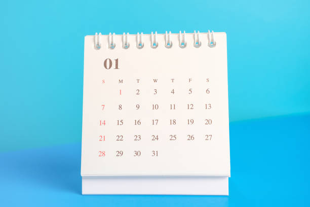 istock White calendar on blue background close-up, planning concept. 1819393188