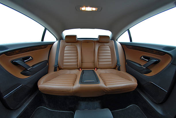 Rear of nice car with brown leather seats and center console stock photo