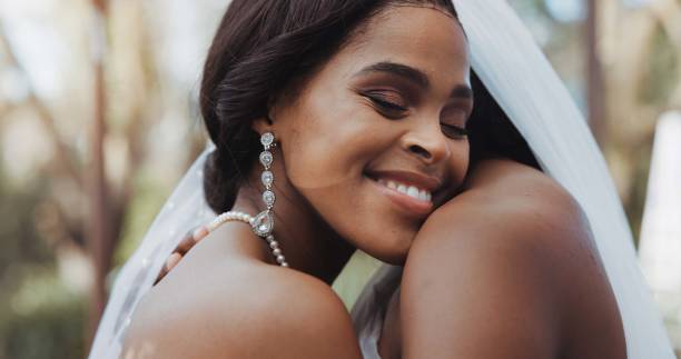 istock Lesbian, marriage and couple hug at wedding for commitment, love celebration and ceremony. Relationship, African and women dance for lgbt, queer and gay romance for connection, care and bonding 1819395938