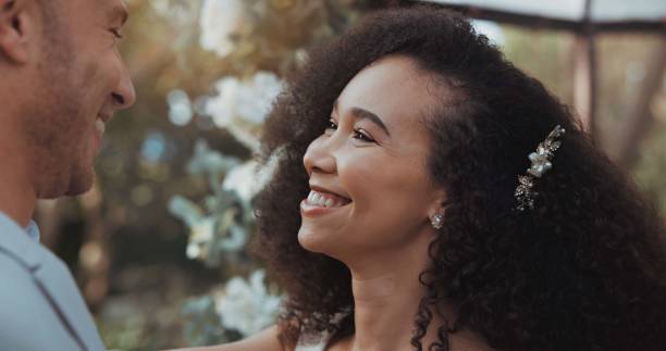 istock Love, dancing and bride at wedding for commitment and in celebration at a outdoor marriage ceremony or event for trust. Husband, wife and happy woman with smile and care for partner together 1819424897