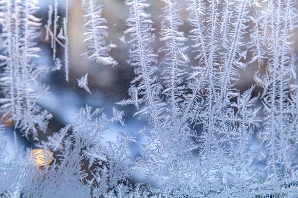 istock Frost drawing texture on a window on a cold winter day 1819537029