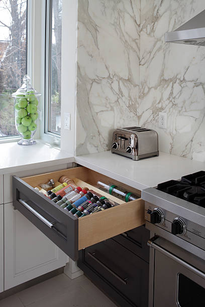 Luxury Kitchen Spice drawer in  modern luxury kitchen in North American private residence. spice rack stock pictures, royalty-free photos & images