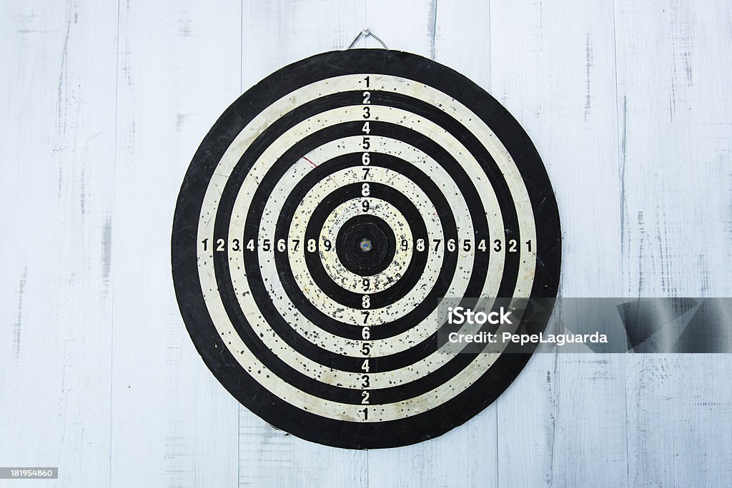 Old used bull's eye Old used bull's eye hanging on wall. Accuracy Stock Photo