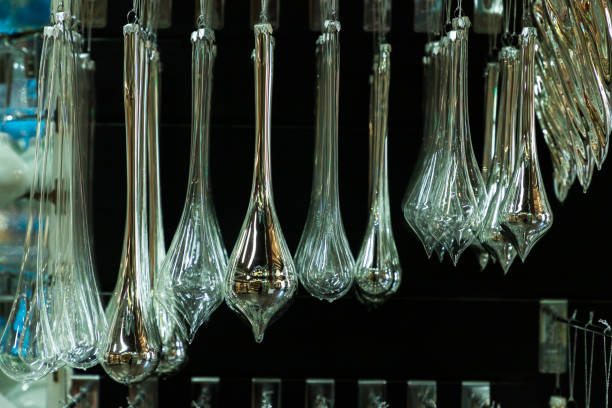 In a Christmas sphere store, many pieces of blown glass of different shapes are displayed for sale to tourists.
