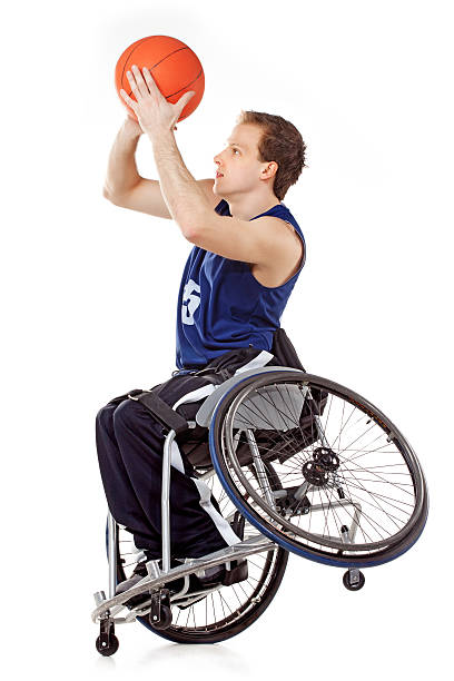 wheelchair basketball player - men chair wheelchair sport stock-fotos und bilder