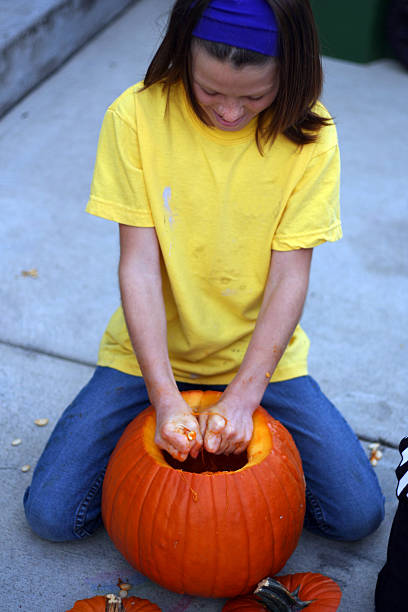 istock Girl with Pumpkin 181955744