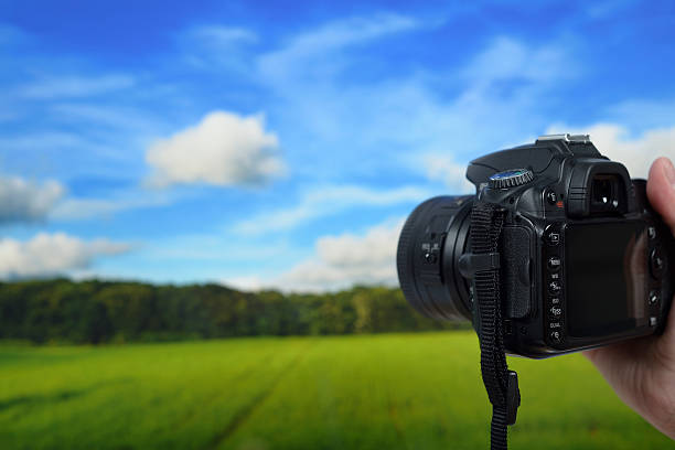 istock Man photographing landscapes with a digital camera 181956093