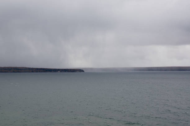istock Raining at a distance over the lake on a cold afternoon 1819561682