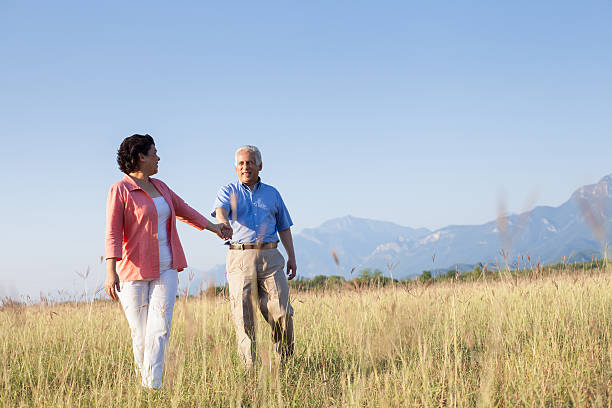 istock Senior couple holding hand and walking 181956440