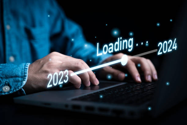 istock Businessman using laptop computer with downloading tool bar for countdown 2023 to 2024 , Merry Christmas and happy new year preparation by technology concept. 1819566198