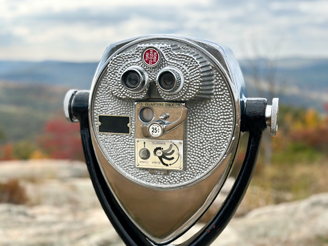 Coin operated viewer in front of beautiful landscape from the top of Bear Mountain in New York