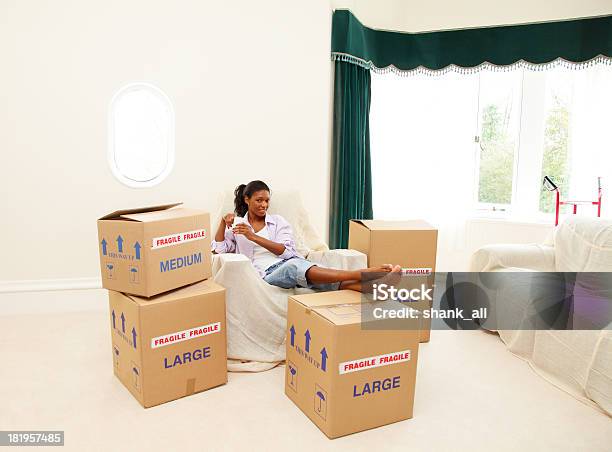 Mature Female Moving House Stock Photo - Download Image Now - Moving House, Box - Container, Coffee - Drink