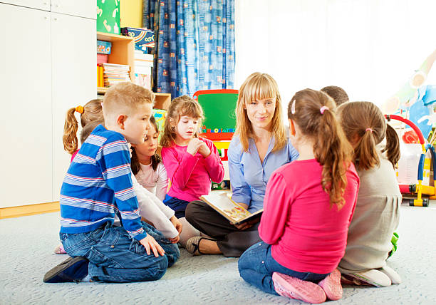 istock Teacher Telling A Story to Children. 181957608