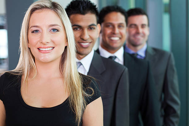 istock business group in a row smiling 181957835
