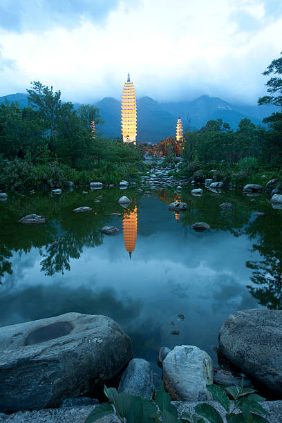 Dali three white pagodas and Cangshan Mountain in the night