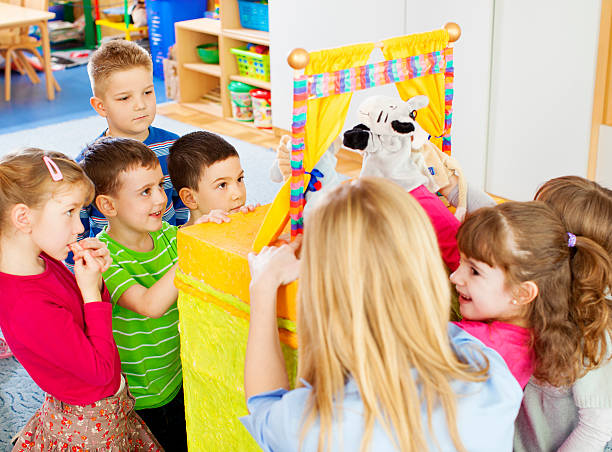 istock Children Playing Finger Puppet Show. 181958612