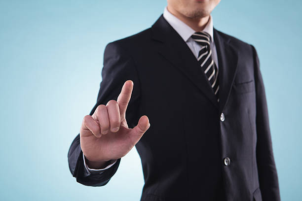 istock businessmen  white background is touching on glass. Focused at 181958646