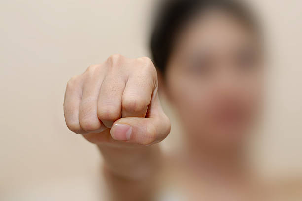 istock woman fist 181958680
