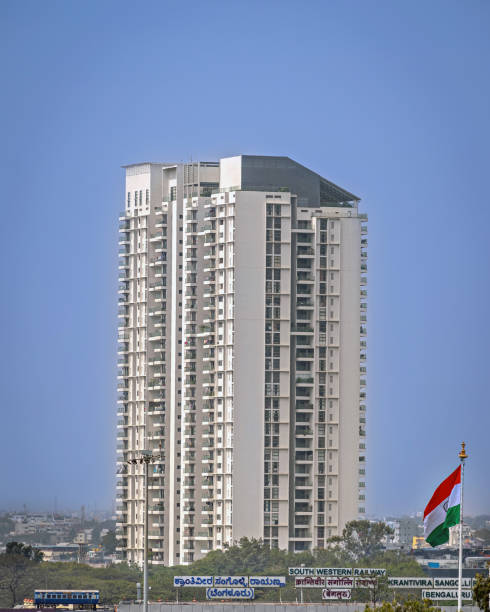 Low angle view of two birds flying over an art deco style building