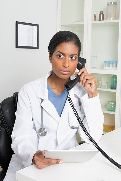istock Female Doctor Using Telephone 181958790