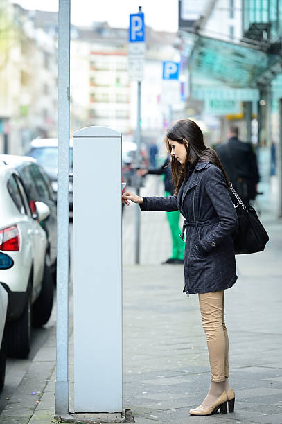 istock Woman and parking meter 181958842