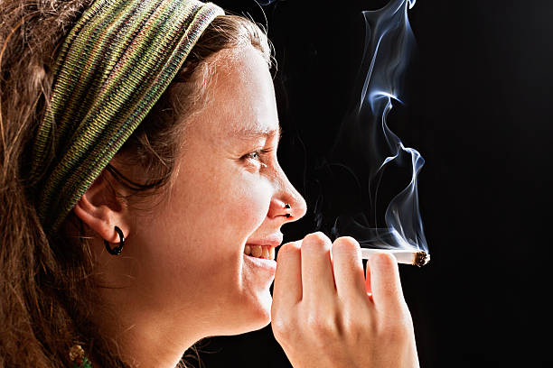 istock Pretty happy hippie smoking marijuana 181959029