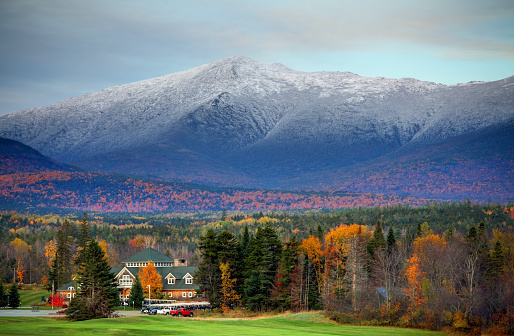 Mt Washington in New Hampshire is the highest peak in the Northeastern United States at 6,288 ft. Photo taken during the peak fall foliage season. New Hampshire is one of New England's most popular fall foliage destinations bringing out some of  the best foliage in the United States