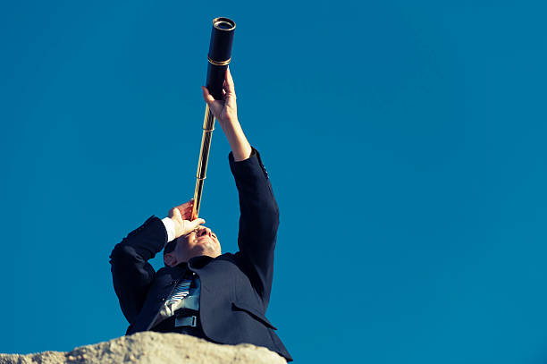 istock Businessman looking to the future with telescope 181959503