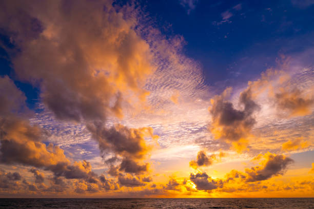 istock Beautiful colorful sunset or sunrise sky over sea with dramatic clouds nature environment background 1819612123