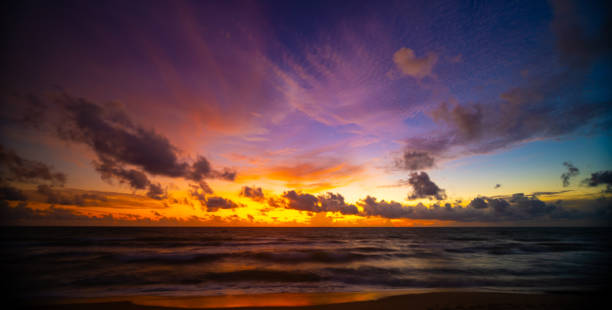 istock Beautiful colorful sunset or sunrise sky over sea with dramatic clouds nature environment background 1819612193