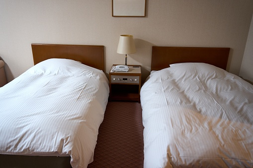 Twin room in a typical Japanese hotel.