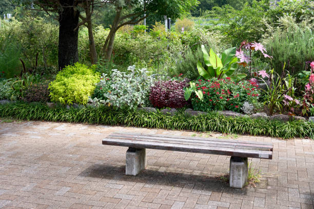 istock Wooden bench with flower bed in the background 1819618446