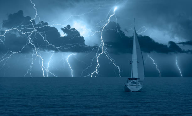 istock Sailing yacht in a stormy weather with thunder and lightning 1819639746