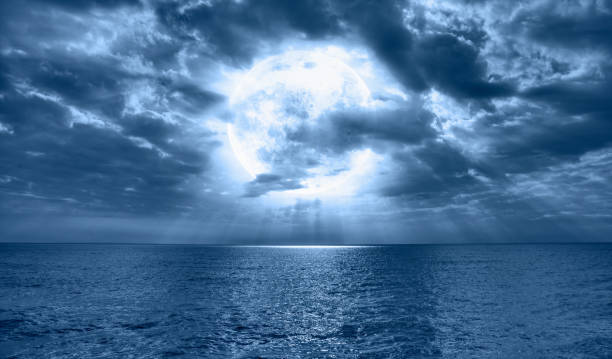 istock Night sky with full bright moon in the clouds 1819642947