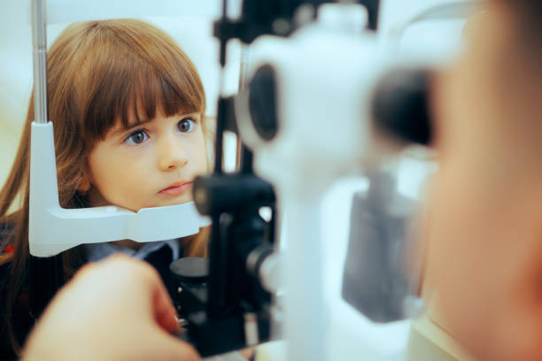 istock Toddler Girl During Eye Examination with a Slit Lamp Microscope. 1819644000