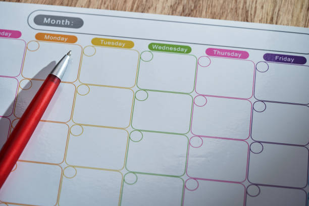 Calendar page with a ballpoint pen.