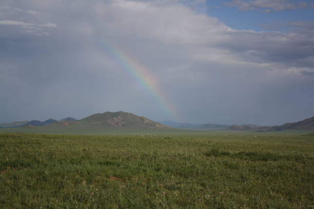 A  precious rainbow in the silent steppe of Khuvsgul province, western Mongolia. stock photo