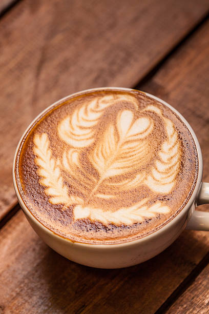 istock Latte art, coffee on the wooden desk as background. 181965675