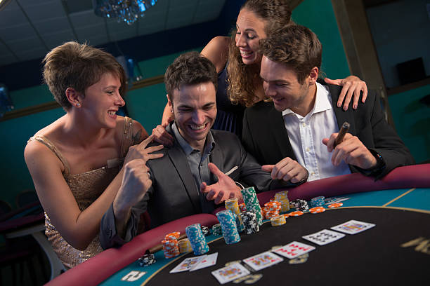 istock adult group celebrating friend winning at roulette 181966128