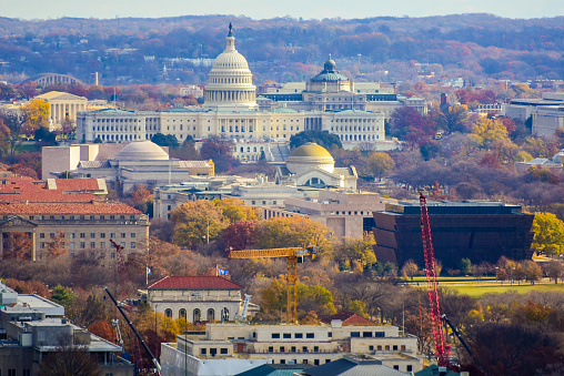 Domed UlS. Capitol overlooks the National Mall and other Federal buildings in Washington, DC.