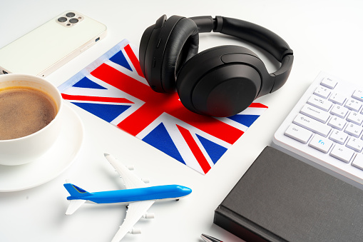 Headset and UK flag on working table close up