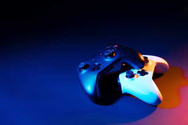 istock Gaming joystick on black background in neon light 1819808380