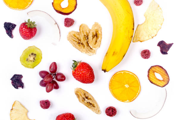 istock assprtied dried  fruits chips scattered on white background. 1819812360